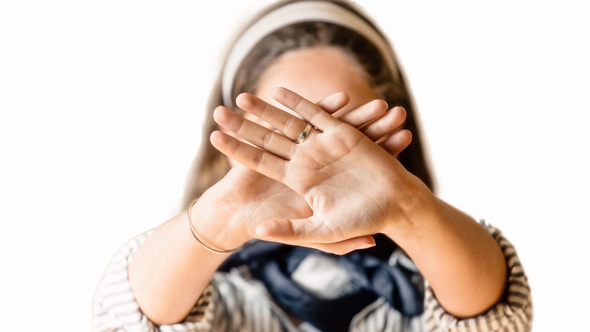 Woman covering face with hands