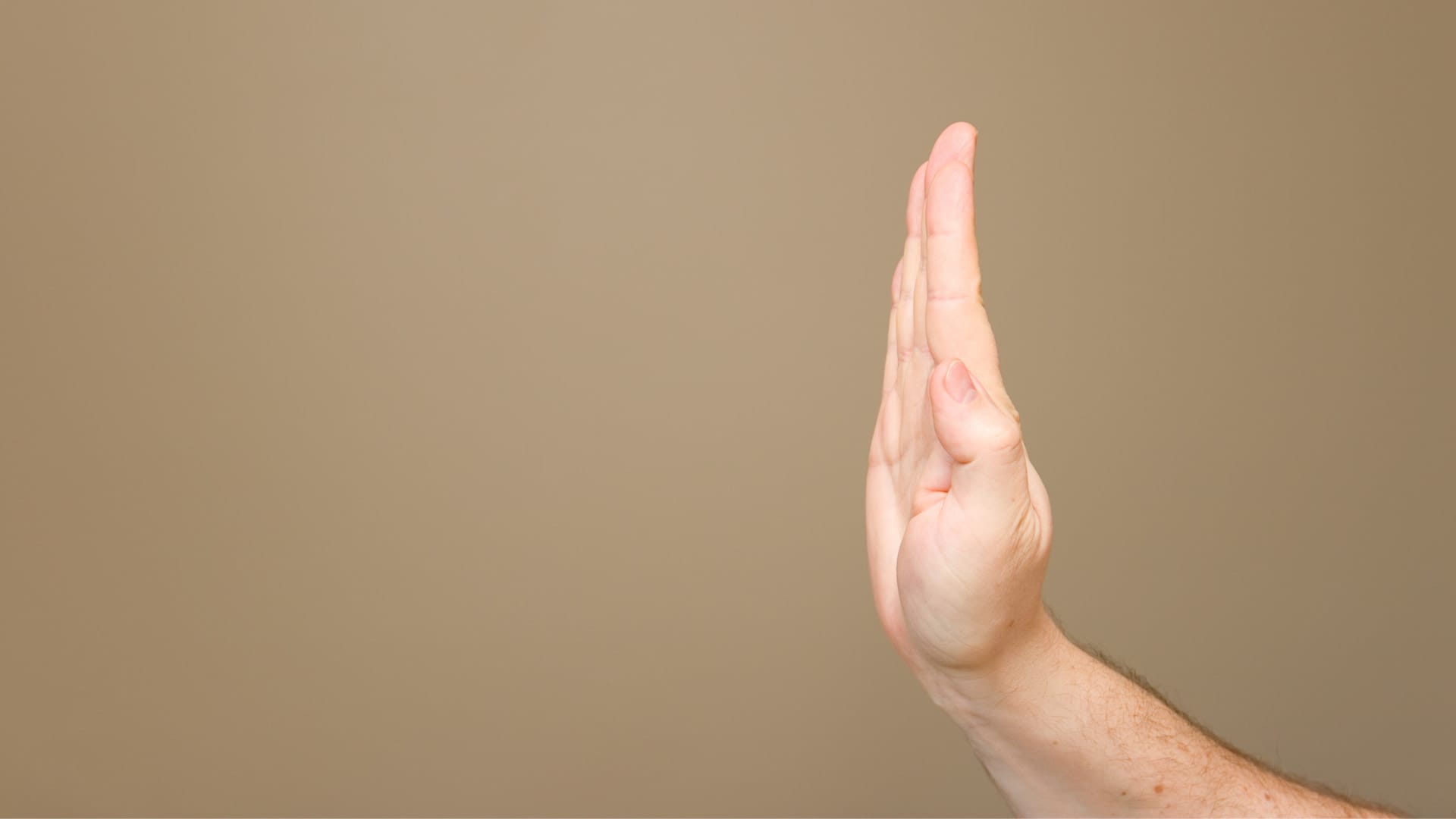 Hand held up like a stop sign