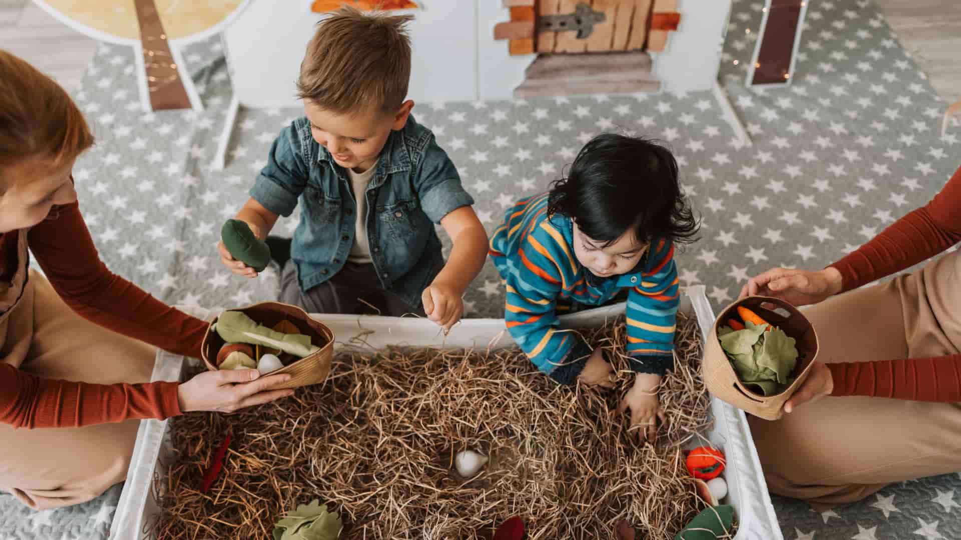 Toddlers in sensory bin