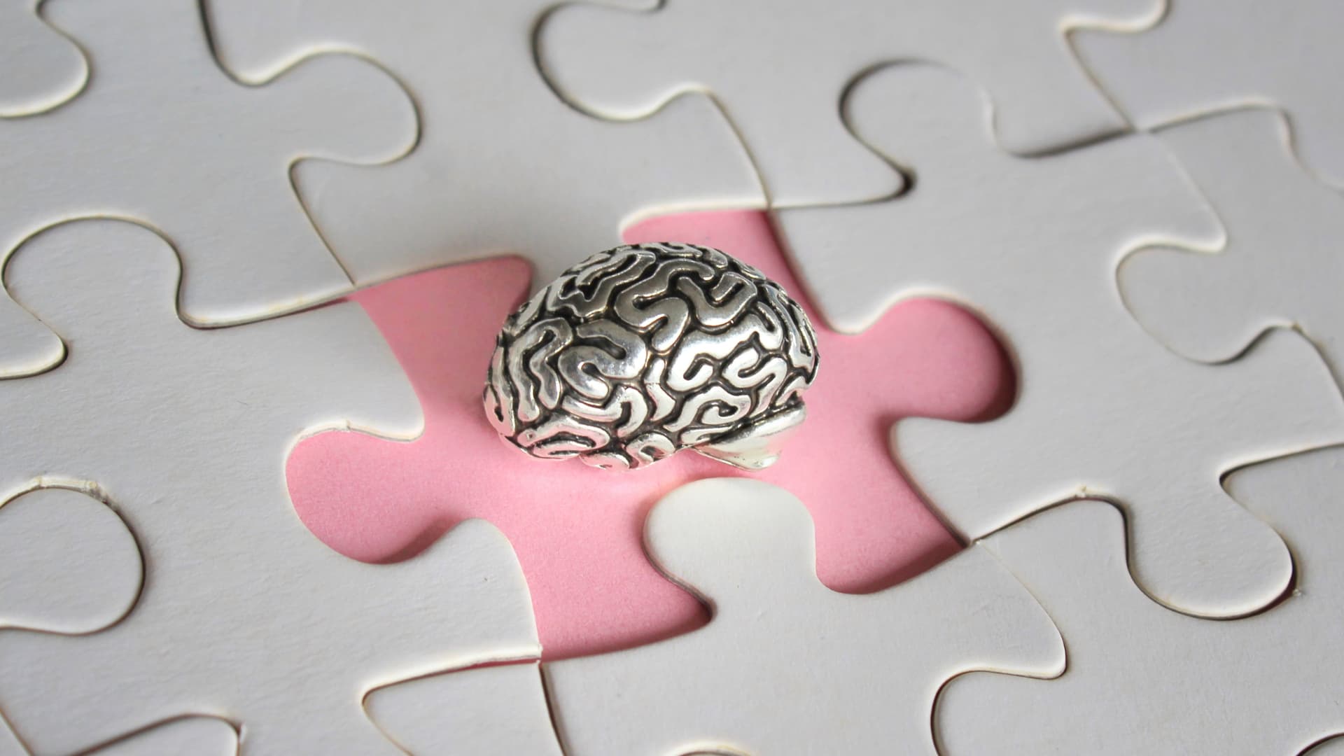Metal brain on a missing puzzle piece