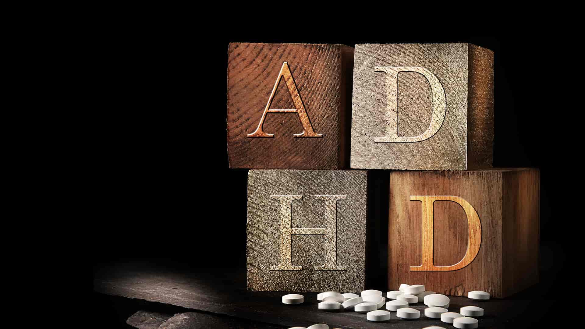 Wooden blocks spell out "ADHD"