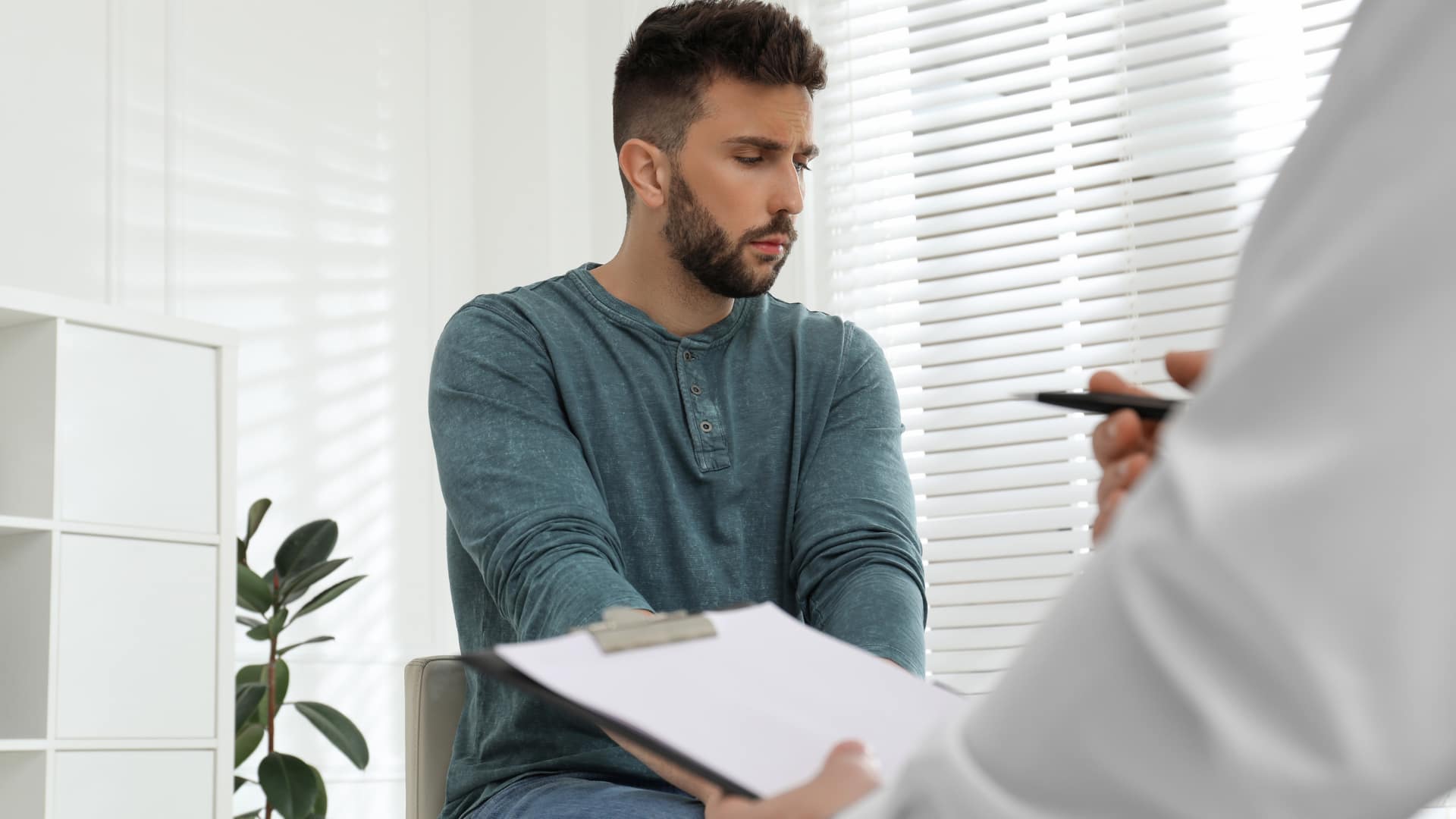Man talking to doctor