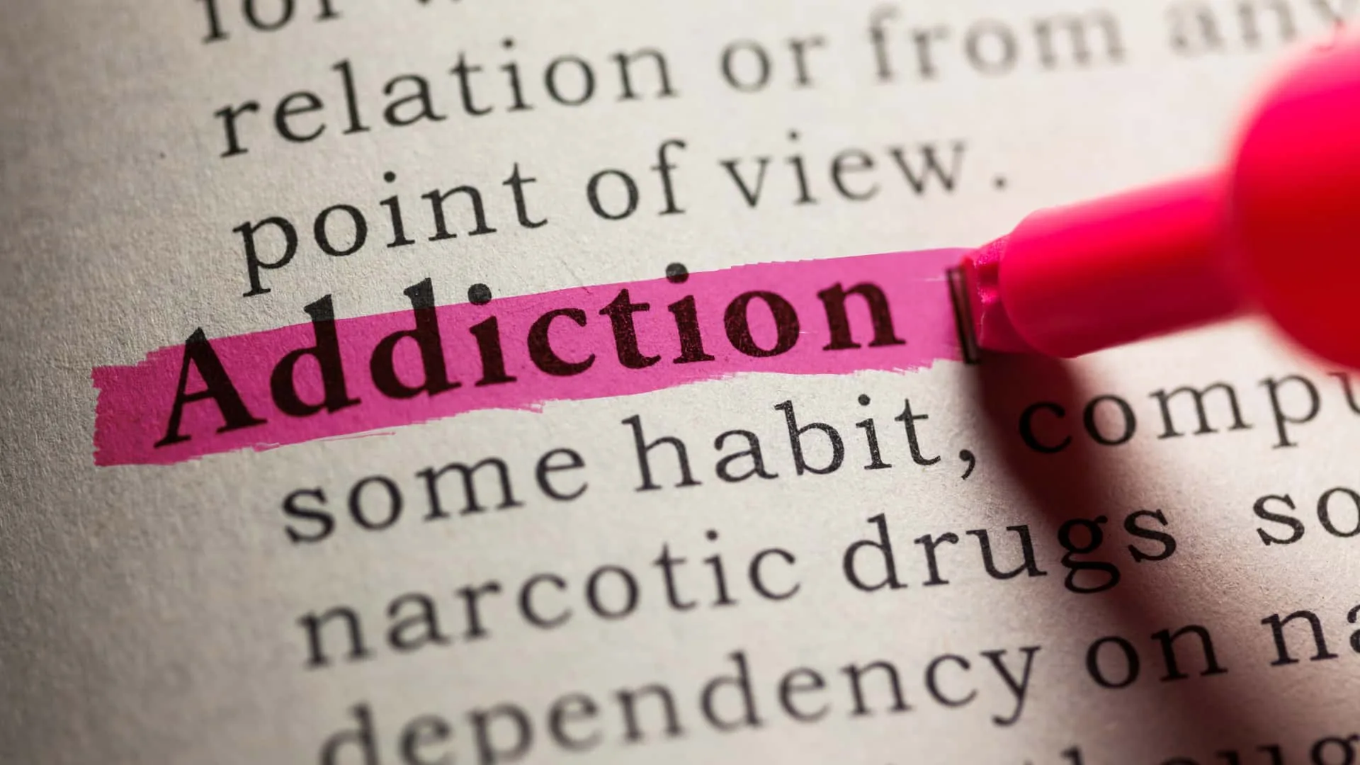 The word "Addiction" is being highlighted.
