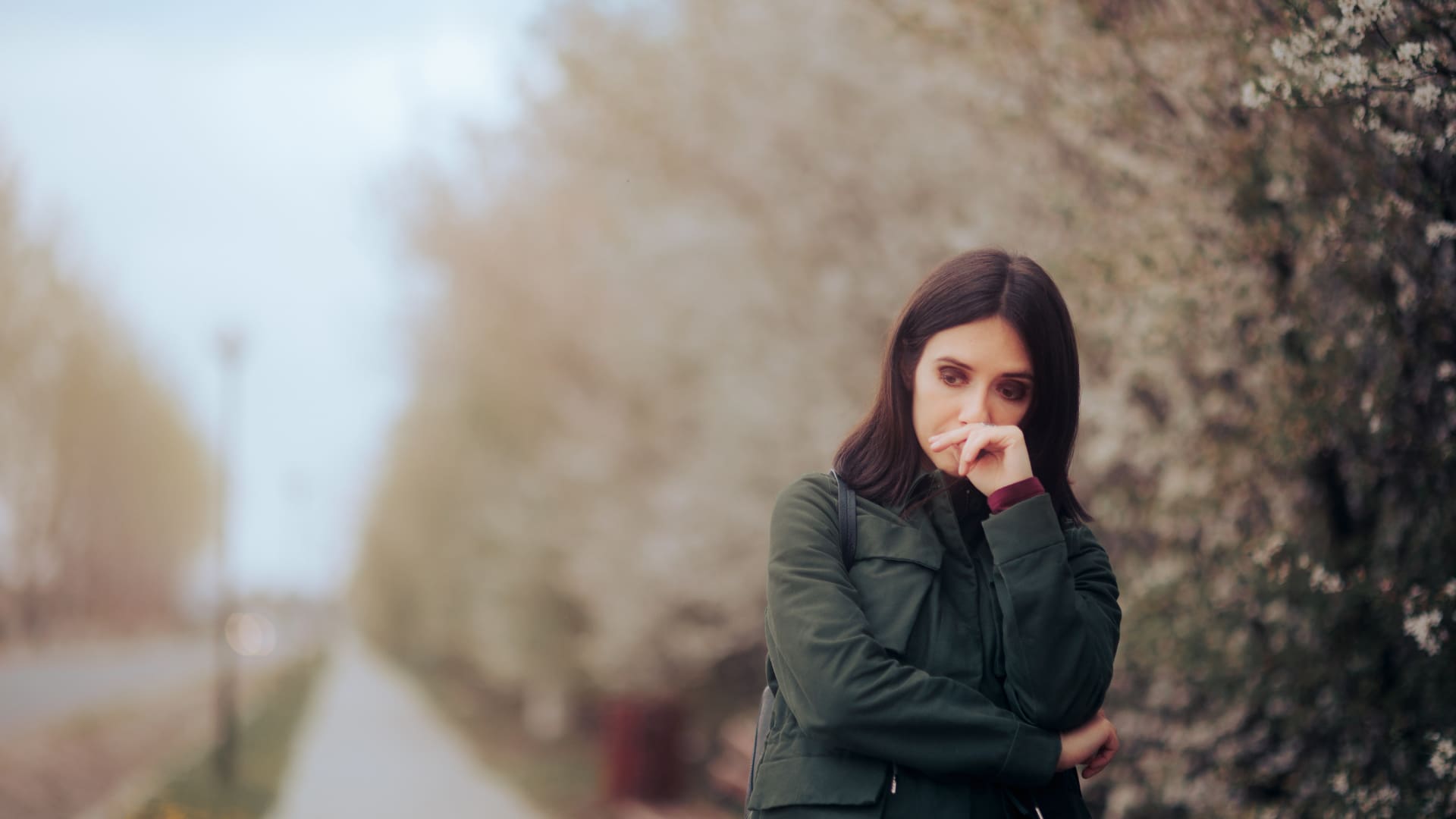 Woman looking sad outside