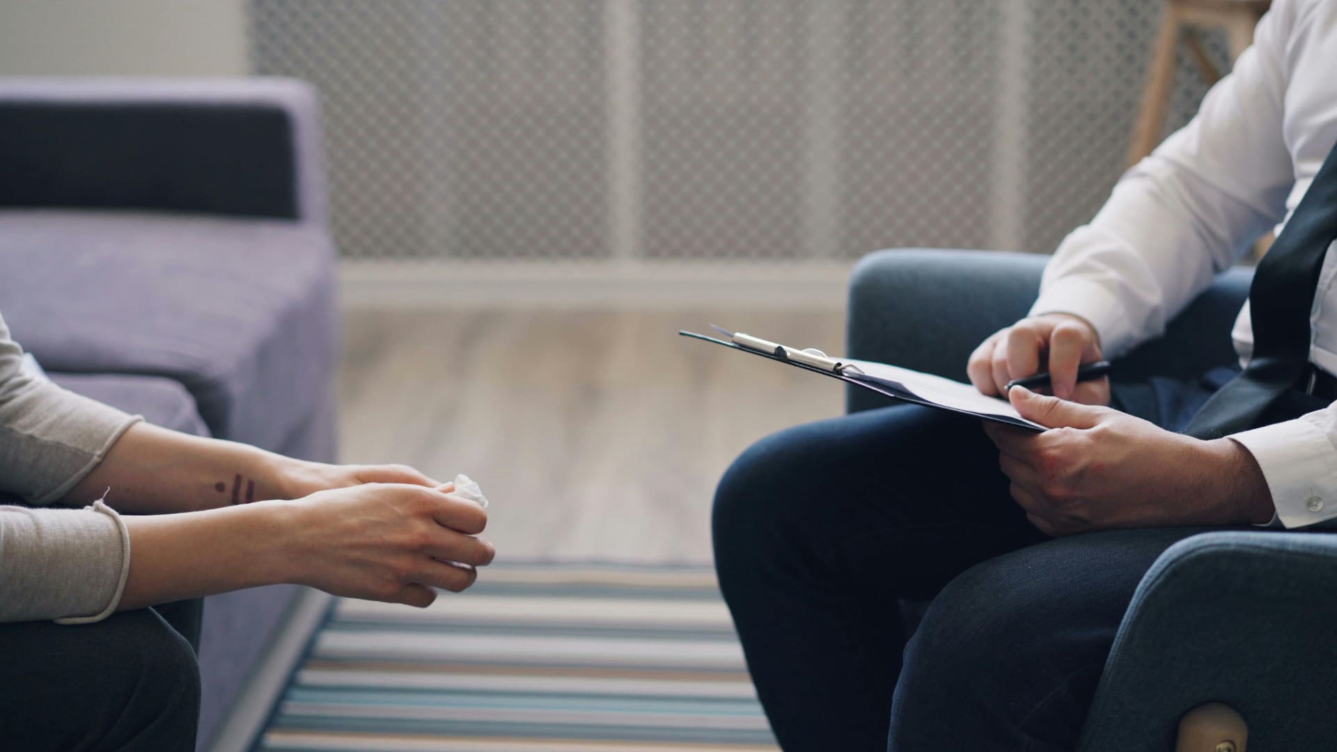 Patient sitting in front of a psychiatrist