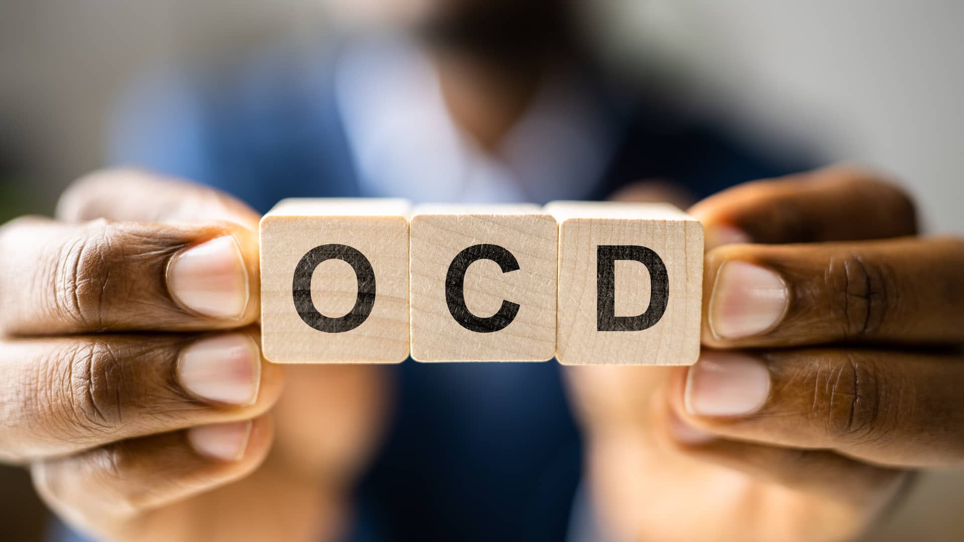 wooden block with OCD written on them and More