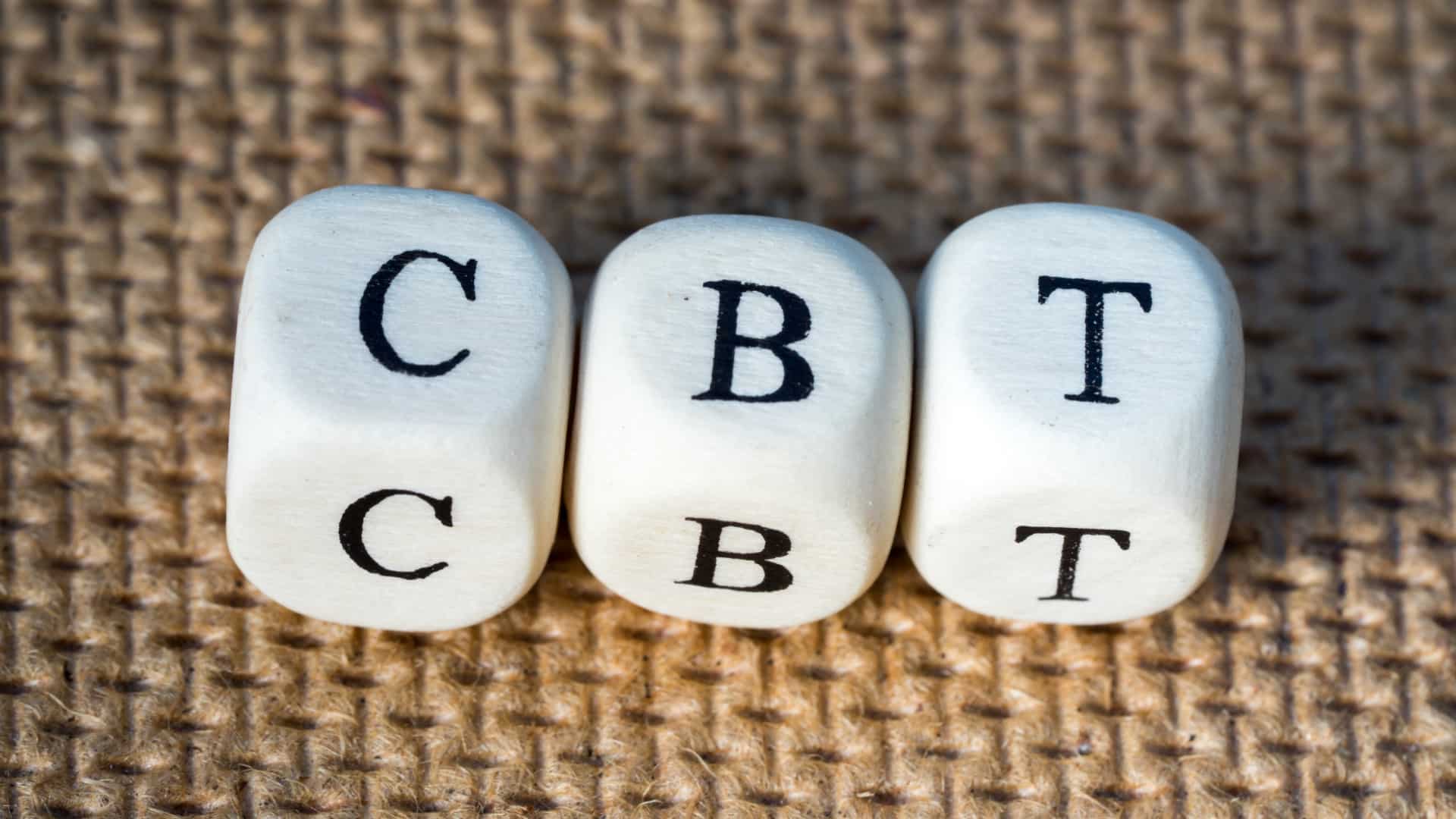 cbt written on white blocks with Psychiatrist in Lombard