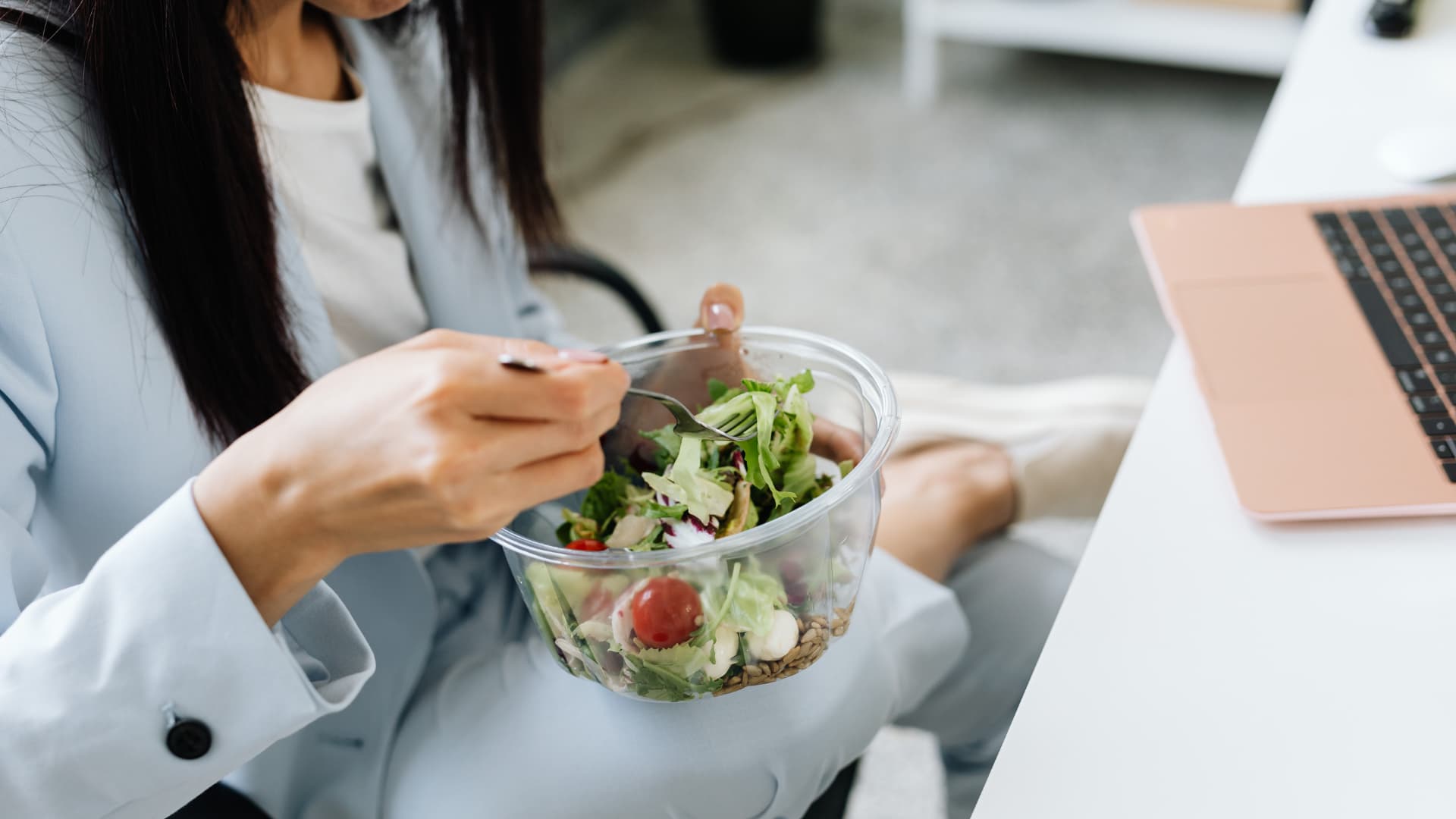Girl eating healthy food from a bowl